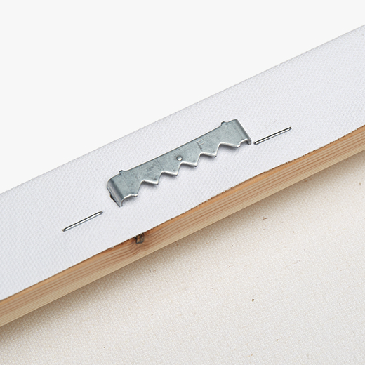 Close-up of stretched canvas hanging hardware